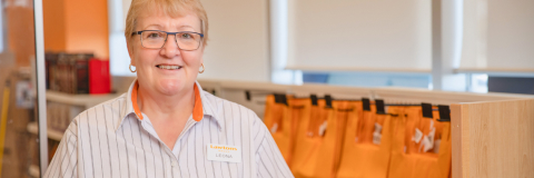 A picture of a lady smiling.